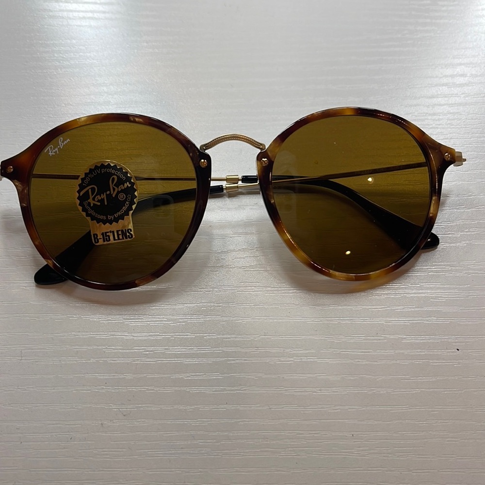 brand new Ray Ban sunglasses.